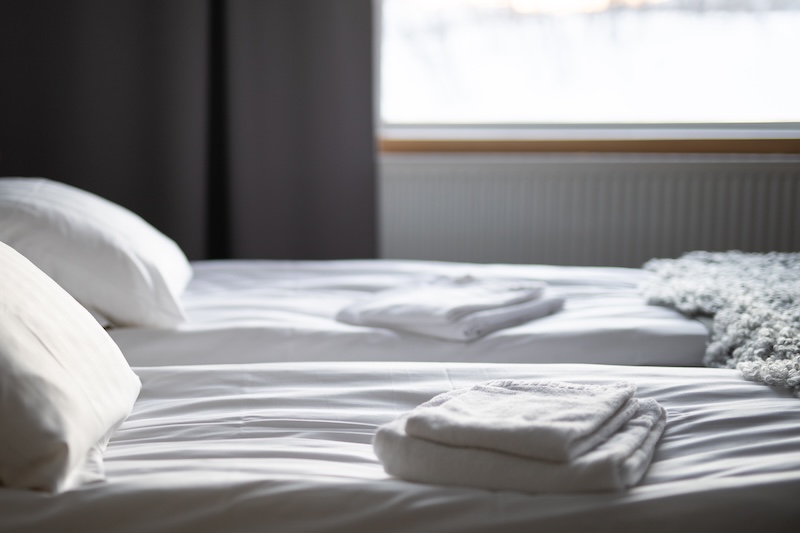 Neatly stacked clean linen at Marvin Laundry
